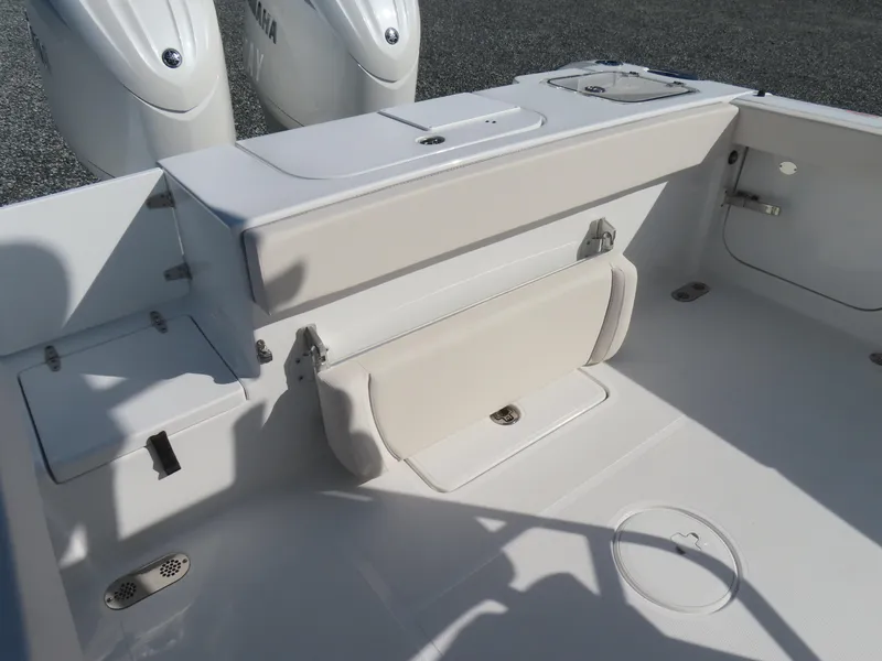 Slide: The Image of 2024 Sea Hunt Gamefish 25 boat interior with seating and storage features. - 33