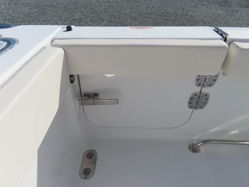 Slide: The Image of 2024 Sea Hunt Gamefish 25 boat interior, featuring a white cushioned seat and stainless steel fittings. - 41