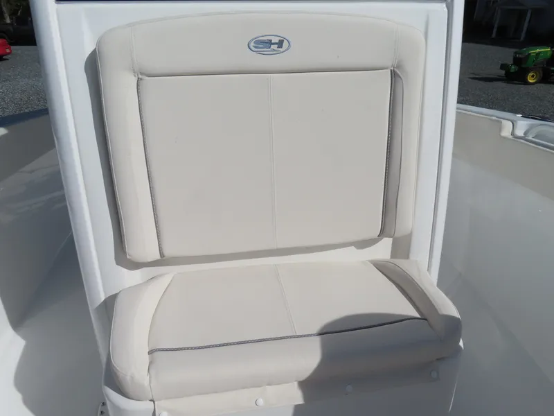 Slide: The Image of 2024 Sea Hunt Gamefish 25 boat seat with beige upholstery and logo. - 8