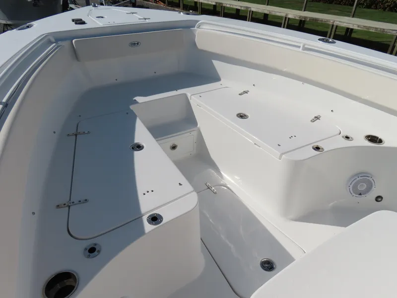 Slide: The Image of 2024 Sea Hunt Gamefish 25 boat interior with spacious seating and storage compartments. - 9