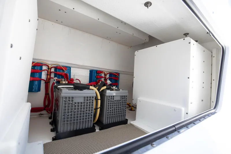Slide: The Image of Electrical system of 2021 Invincible 35 Center Console boat, featuring batteries and wiring. - 18