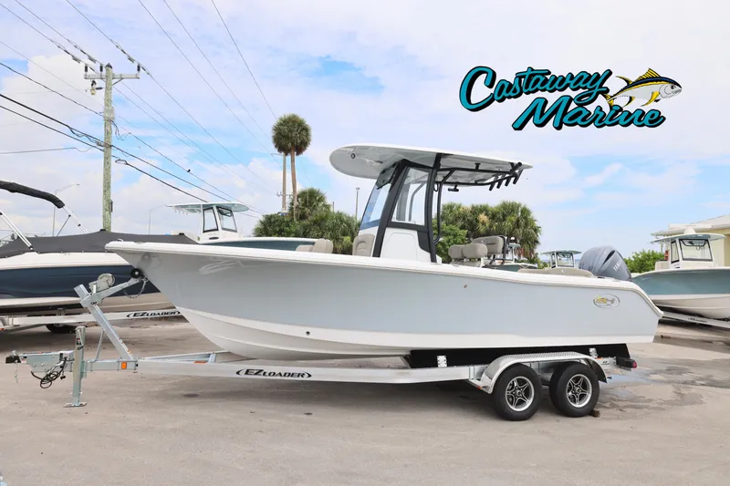Slide: The Image of 2026 Sea Hunt Ultra 235 SE boat on trailer at Castaway Marine dealership. - 0