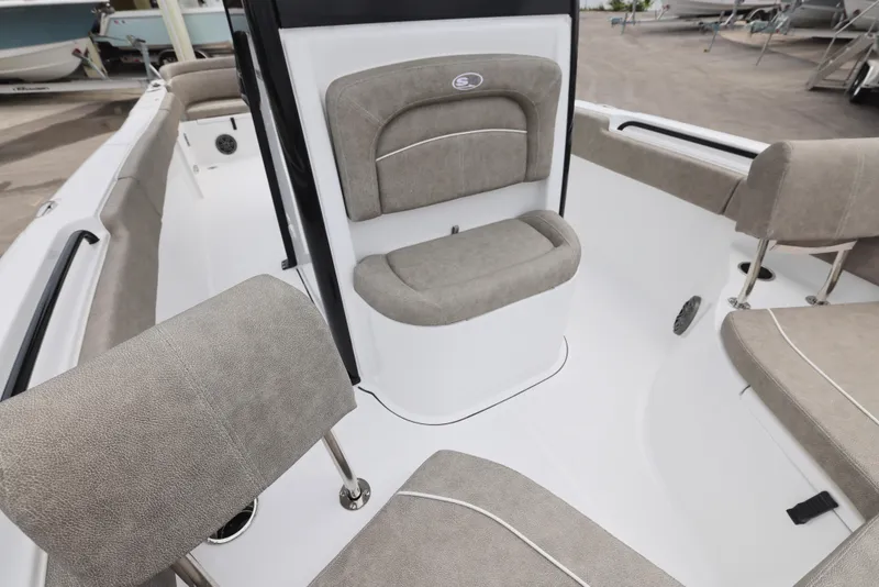 Slide: The Image of 2026 Sea Hunt Ultra 235 SE boat interior with cushioned seating and sleek design. - 12