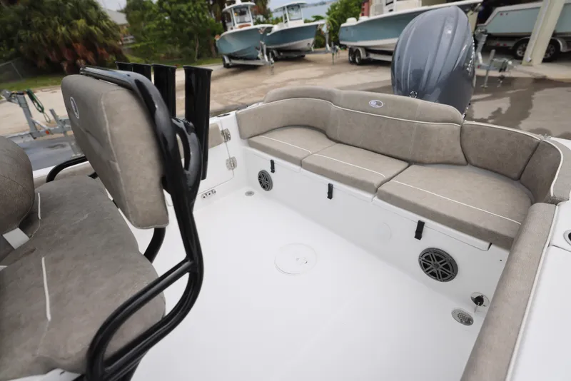 Slide: The Image of 2026 Sea Hunt Ultra 235 SE boat interior with cushioned seating and modern design. - 16