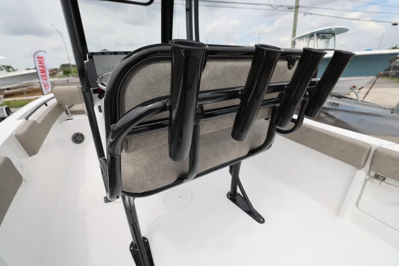 Slide: The Image of 2026 Sea Hunt Ultra 235 SE boat interior with rod holders and seating. - 17