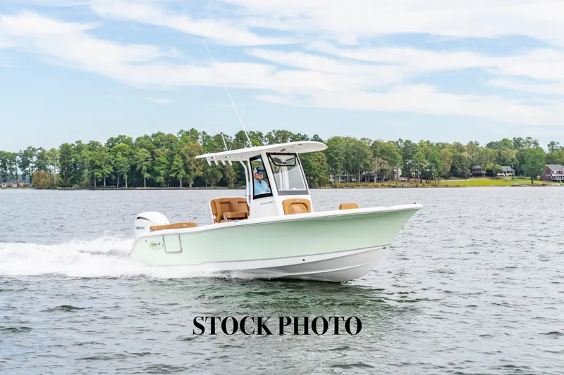 Slide: The Image of 2026 Sea Hunt Ultra 235 SE boat cruising on a lake, stock photo. - 19