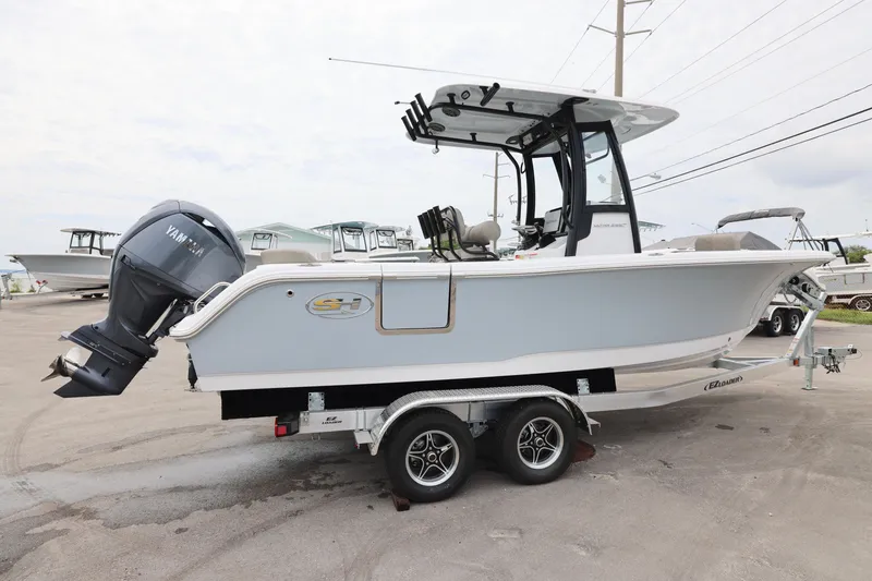 Slide: The Image of 2026 Sea Hunt Ultra 235 SE boat on trailer with Yamaha outboard motor. - 6