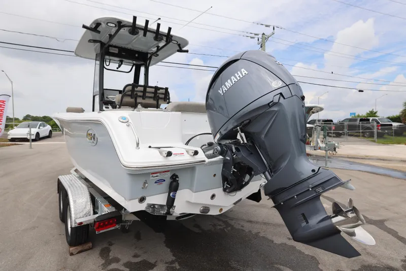 Slide: The Image of 2026 Sea Hunt Ultra 235 SE boat with Yamaha outboard motor on a trailer. - 9