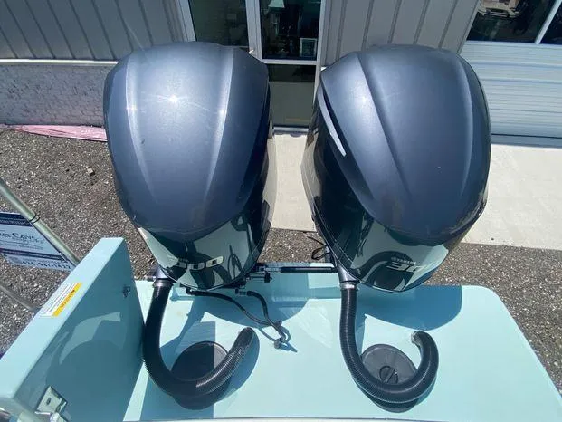 Slide: The Image of Twin outboard motors on a 2013 Regulator 28 Forward Seating boat. - 7