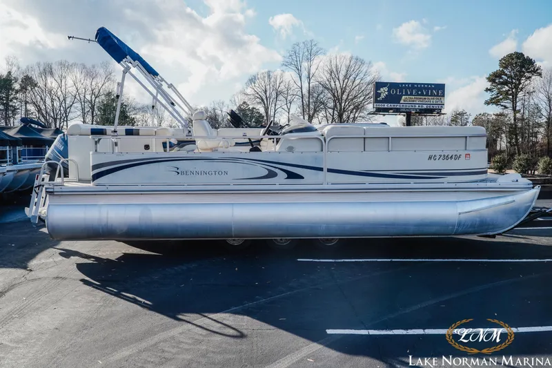 Slide: The Image of 2006 Bennington 2275 RL pontoon boat parked at Lake Norman Marina. - 1