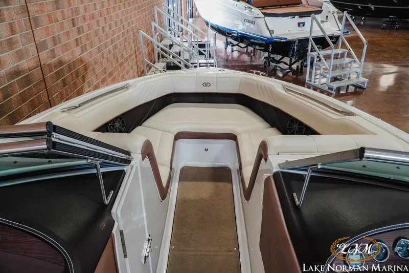 Slide: The Image of 2013 Cobalt 232 boat interior with plush seating at Lake Norman Marina. - 12