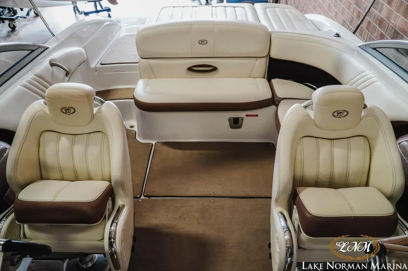 Slide: The Image of Interior of a 2013 Cobalt 232 boat with beige and brown seating. - 14