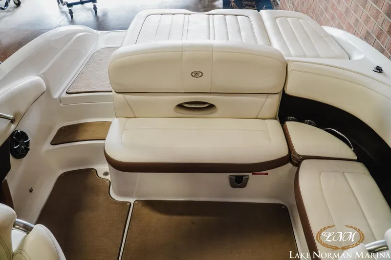 Slide: The Image of Interior of a 2013 Cobalt 232 boat with beige seating at Lake Norman Marina. - 15