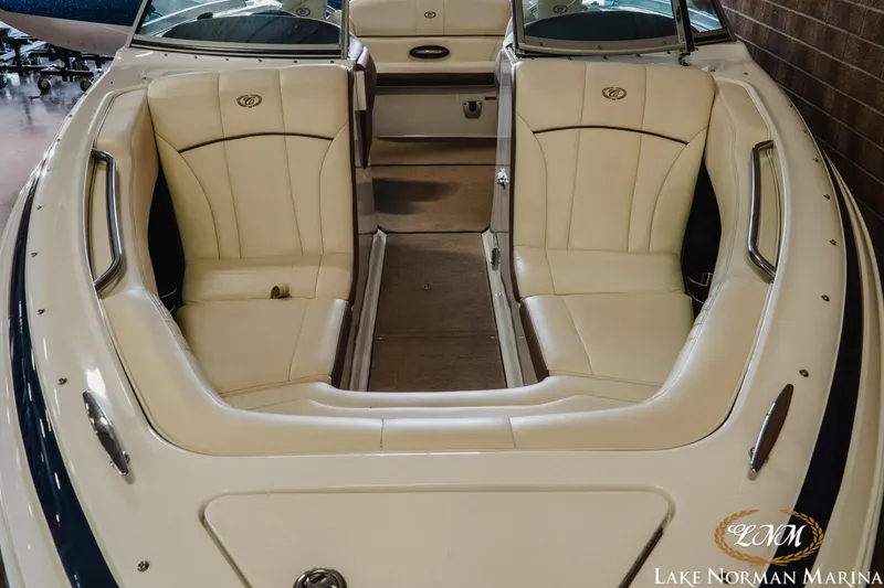 Slide: The Image of 2013 Cobalt 232 boat interior with cream leather seating at Lake Norman Marina. - 5