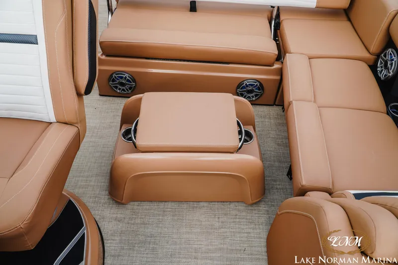 Slide: The Image of 2023 Harris FloteBote 230 Solstice interior with tan seating and integrated speakers. - 15
