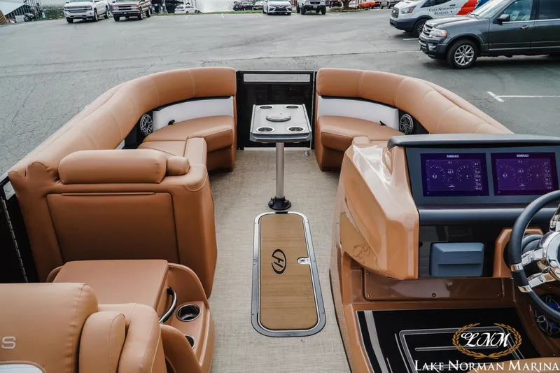 Slide: The Image of 2023 Harris FloteBote 230 Solstice interior with tan seating and modern dashboard at Lake Norman Marina. - 8