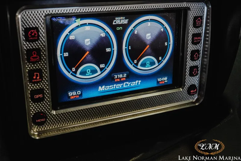 Slide: The Image of Dashboard display of a 2014 MasterCraft X-Star boat showing speed and RPM gauges. - 21