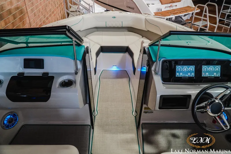 Slide: The Image of 2022 Regal LS2 Surf boat interior with modern dashboard and seating. - 12