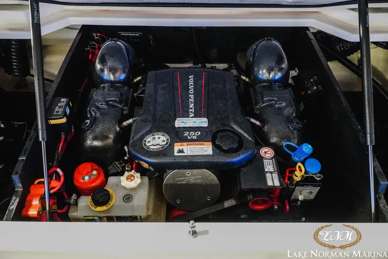Slide: The Image of Engine compartment of 2022 Regal LS2 Surf boat with Volvo Penta 250 V6 engine. - 19