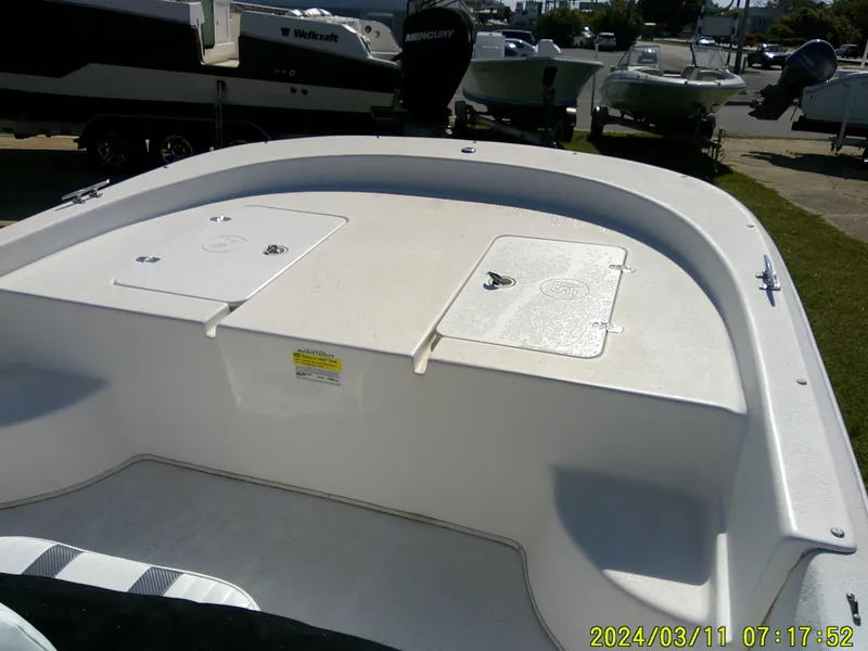 Slide: The Image of 2012 Carolina Skiff 198 DLV boat deck with storage compartments. - 7