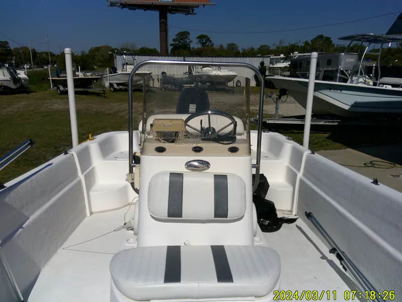 Slide: The Image of 2012 Carolina Skiff 198 DLV boat interior with steering console and seating. - 9
