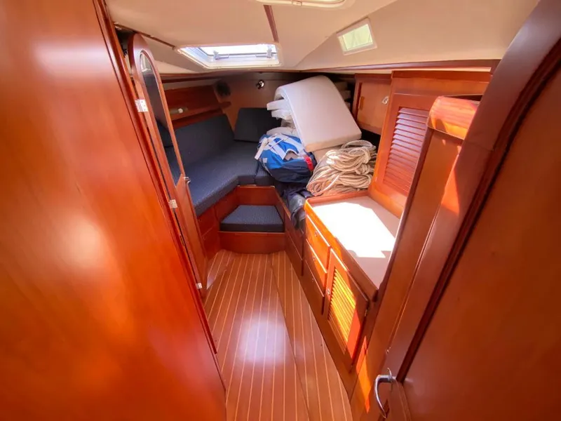 Slide: The Image of Cozy cabin interior of 2000 J Boats J/46 with wooden finish and natural light. - 35