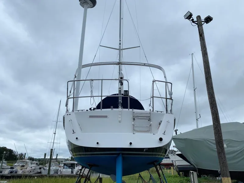 Slide: The Image of Sailboat J/46 from 2000 on stands, overcast sky, marina background. - 42