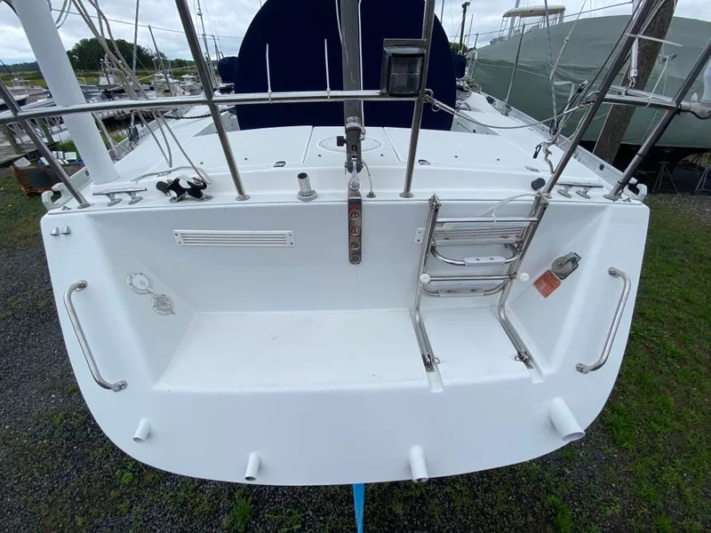 Slide: The Image of Stern view of a 2000 J Boats J/46 sailboat with ladder and railing. - 43