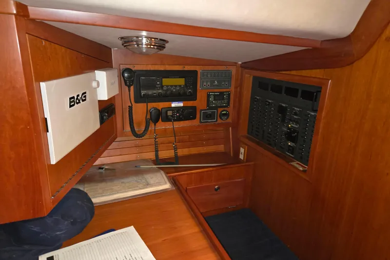 Slide: The Image of Navigation station of 2000 J Boats J/46 yacht with communication equipment and control panels. - 54