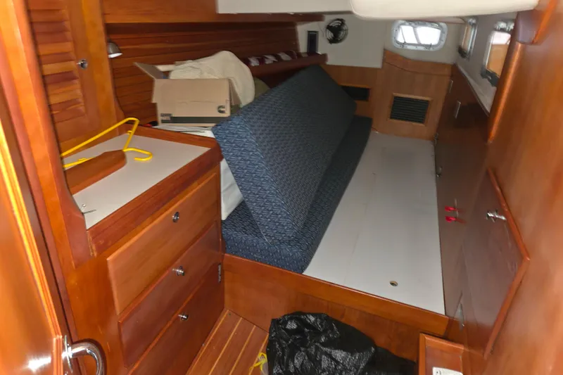 Slide: The Image of Cozy cabin interior of 2000 J Boats J/46 sailboat with wooden furnishings. - 57