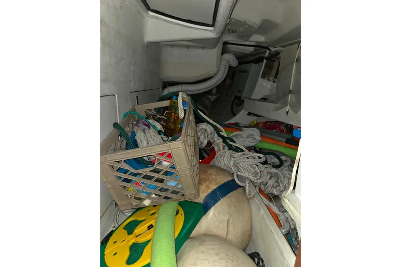 Slide: The Image of Storage area of a 2000 J Boats J/46, filled with ropes and equipment. - 72