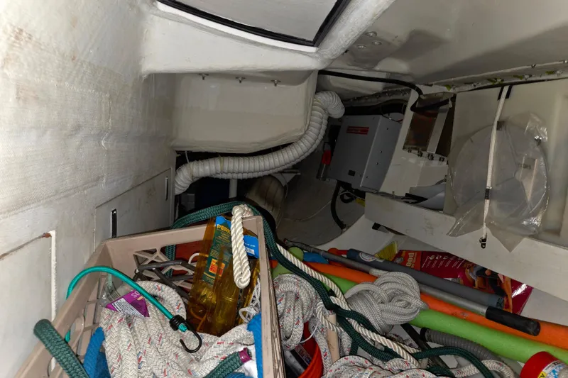 Slide: The Image of Storage area inside a 2000 J Boats J/46, featuring ropes and equipment. - 75