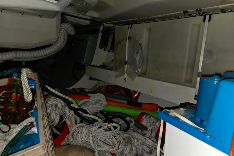 Slide: The Image of Storage area of a 2000 J Boats J/46, featuring ropes and equipment. - 77