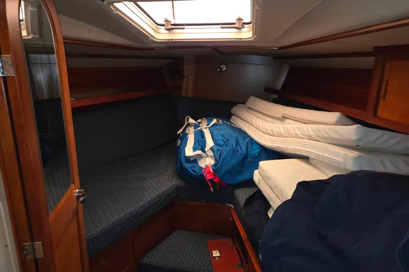Slide: The Image of Interior cabin of 2000 J Boats J/46 sailboat with cushions and gear. - 83