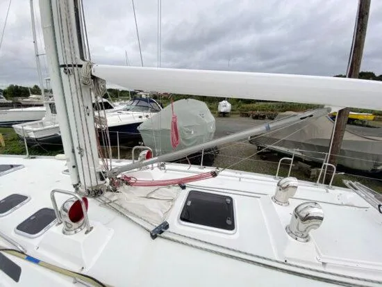 Slide: The Image of Sailboat deck of 2000 J Boats J/46 with rigging and hatches, docked in marina. - 9