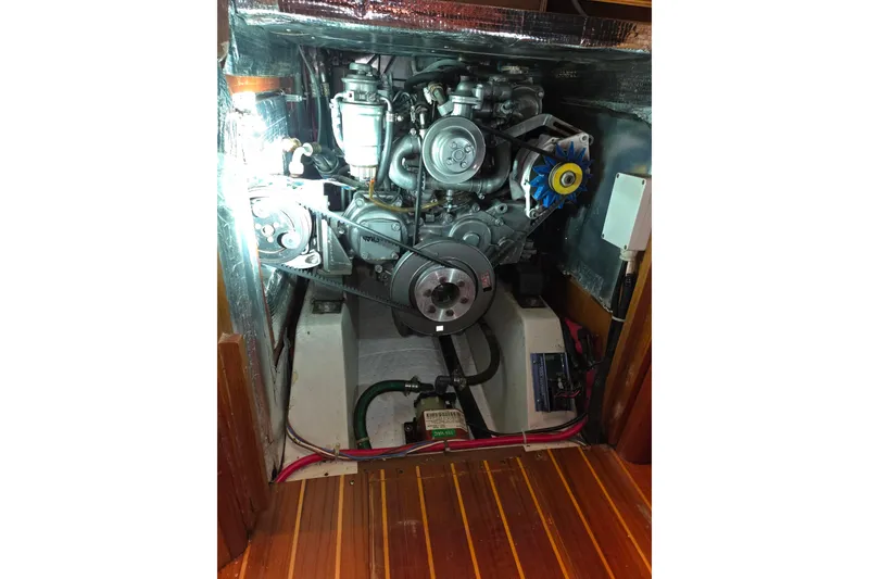 Slide: The Image of Engine compartment of a 2000 J Boats J/46 sailboat, showcasing mechanical components. - 92