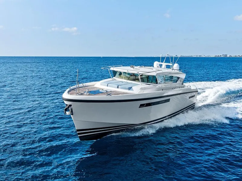 Slide: The Image of 2018 Delta Powerboats 54 IPS cruising on open blue sea. - 13