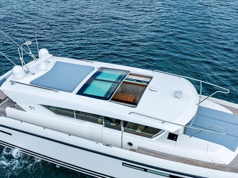 Slide: The Image of 2018 Delta Powerboats 54 IPS cruising on open water, showcasing sleek design and modern features. - 17