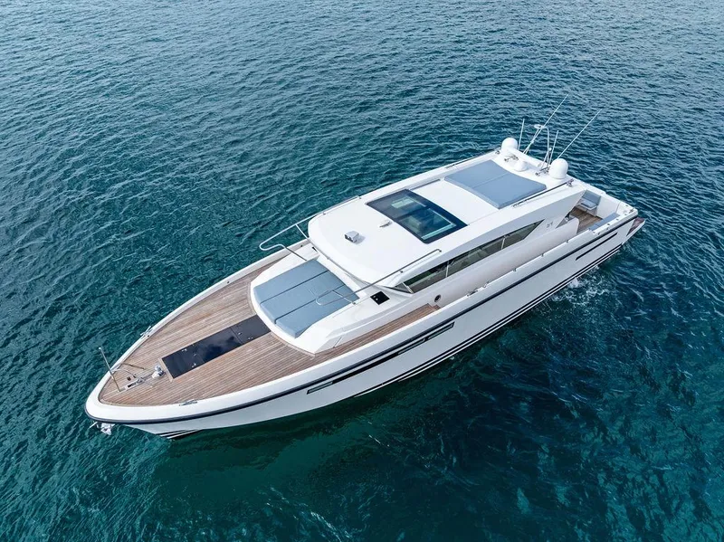 Slide: The Image of 2018 Delta Powerboats 54 IPS yacht cruising on clear blue water. - 18