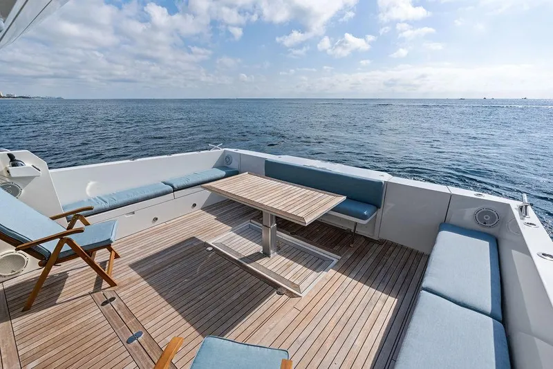 Slide: The Image of Luxurious 2018 Delta Powerboats 54 IPS yacht deck with ocean view and seating area. - 31