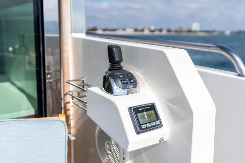Slide: The Image of Control panel on 2018 Delta Powerboats 54 IPS yacht, featuring joystick and display. - 33