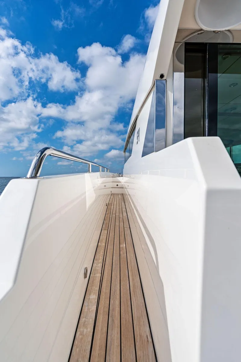 Slide: The Image of 2018 Delta Powerboats 54 IPS yacht deck with blue sky and clouds. - 35