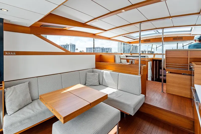 Slide: The Image of Luxurious interior of 2018 Delta Powerboats 54 IPS with modern seating and wooden accents. - 40