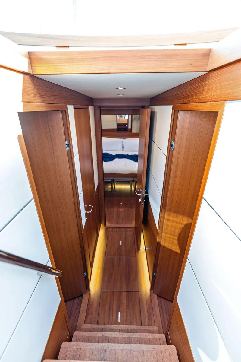 Slide: The Image of Interior view of 2018 Delta Powerboats 54 IPS, featuring elegant wooden finishes and modern design. - 49