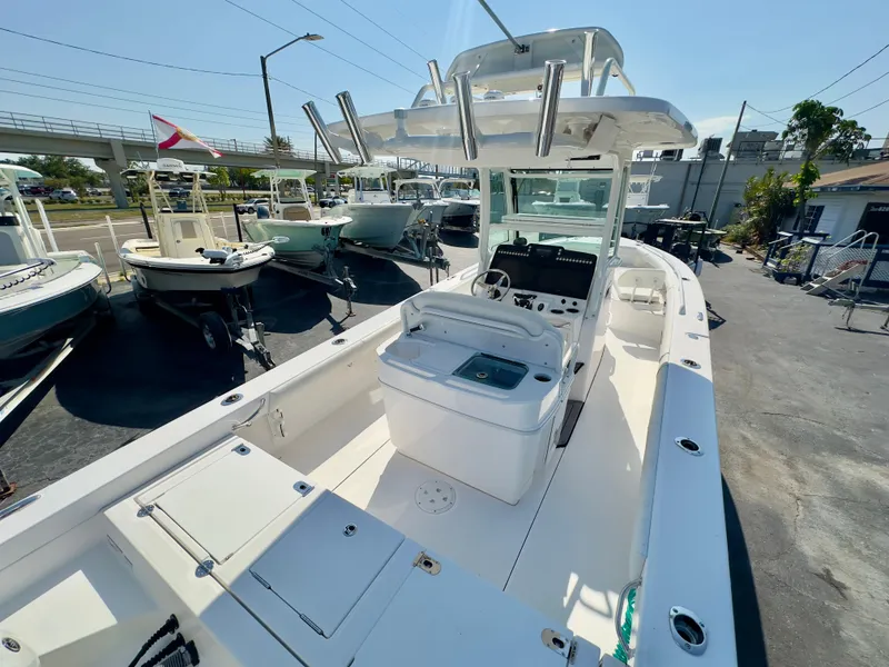 Slide: The Image of 2023 Everglades 273 Center Console boat with spacious deck and modern controls. - 11