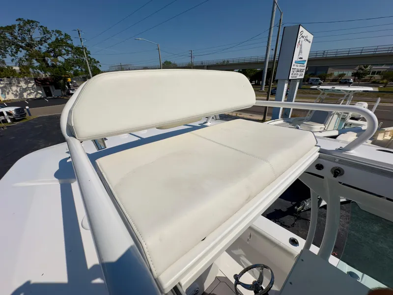 Slide: The Image of 2023 Everglades 273 Center Console boat with white seating on deck. - 27