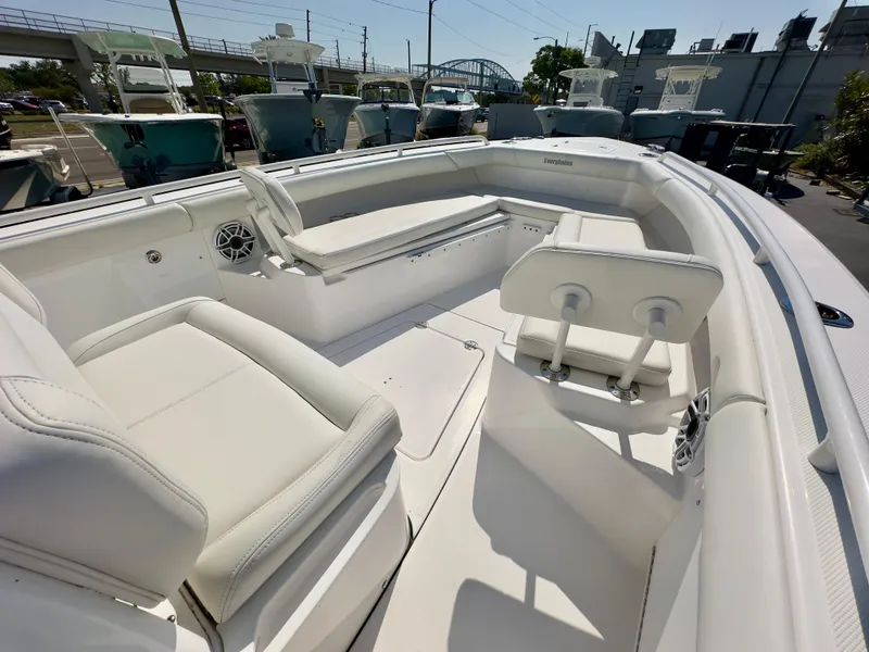 Slide: The Image of 2023 Everglades 273 Center Console boat interior with white seating and modern design. - 31