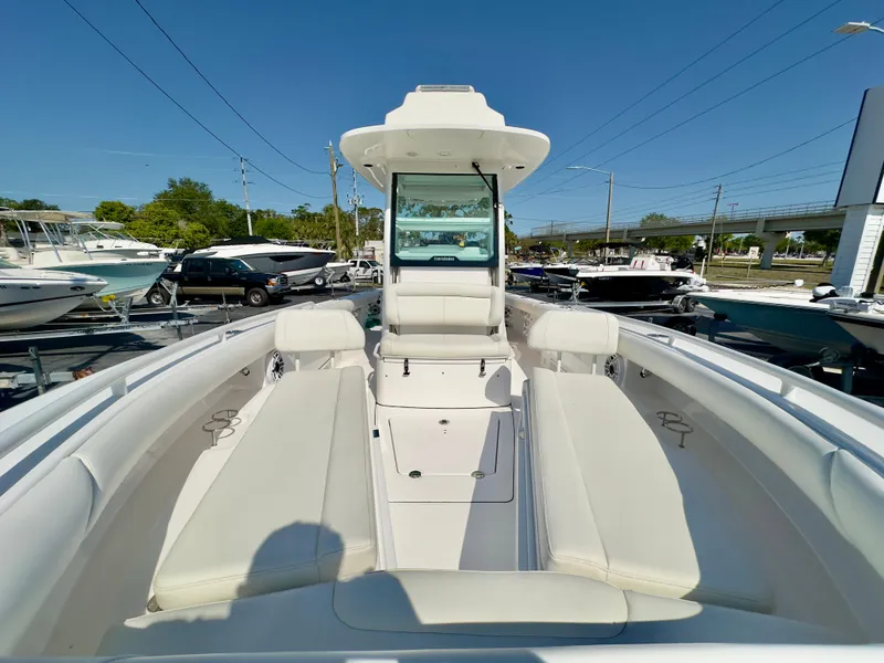 Slide: The Image of 2023 Everglades 273 Center Console boat with spacious seating and modern design. - 35