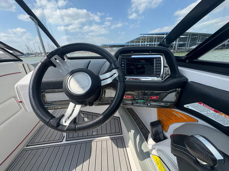 Slide: The Image of Steering wheel and dashboard of 2013 Nautique Super Air Nautique G25 boat. - 11