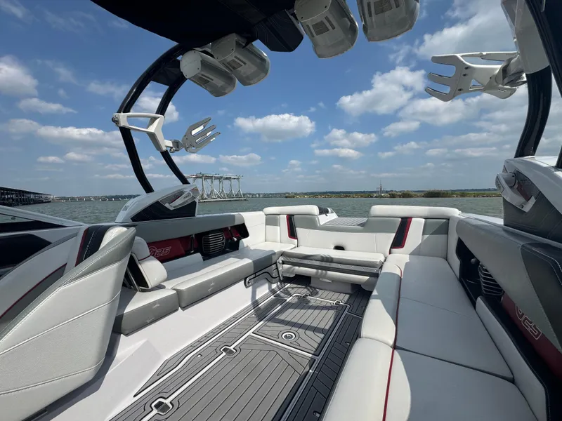 Slide: The Image of 2013 Nautique Super Air Nautique G25 boat interior with spacious seating and modern design. - 12